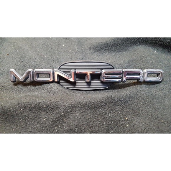 2000 Mitsubishi Montero OEM Fender Mounted "Montero" Badge Logo Emblem - Picture 1 of 4